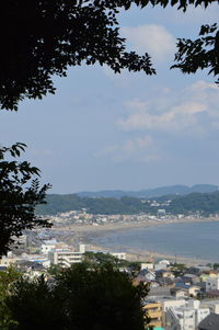 City by sea against sky