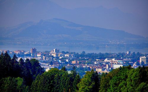 High angle view of buildings and trees against sky