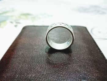 High angle view of wedding rings on table