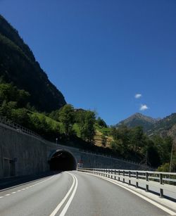 Empty road leading towards mountains