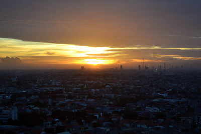 High angle view of city during sunset