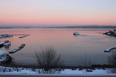 Scenic view of lake against sky during winter