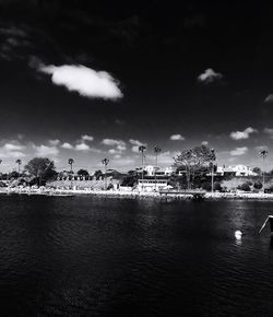 View of town by sea against sky