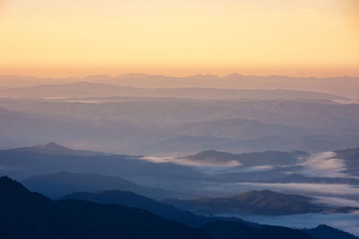 Scenic view of mountains against sky during sunset