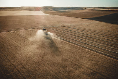 Dry fields at sunset from aerial view