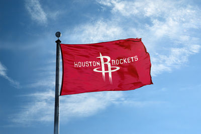Low angle view of flag against sky