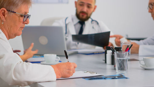 Doctor working at table