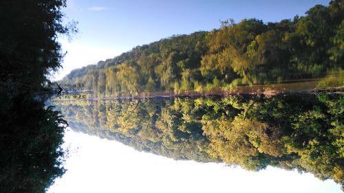 Scenic shot of calm countryside lake against mountain range