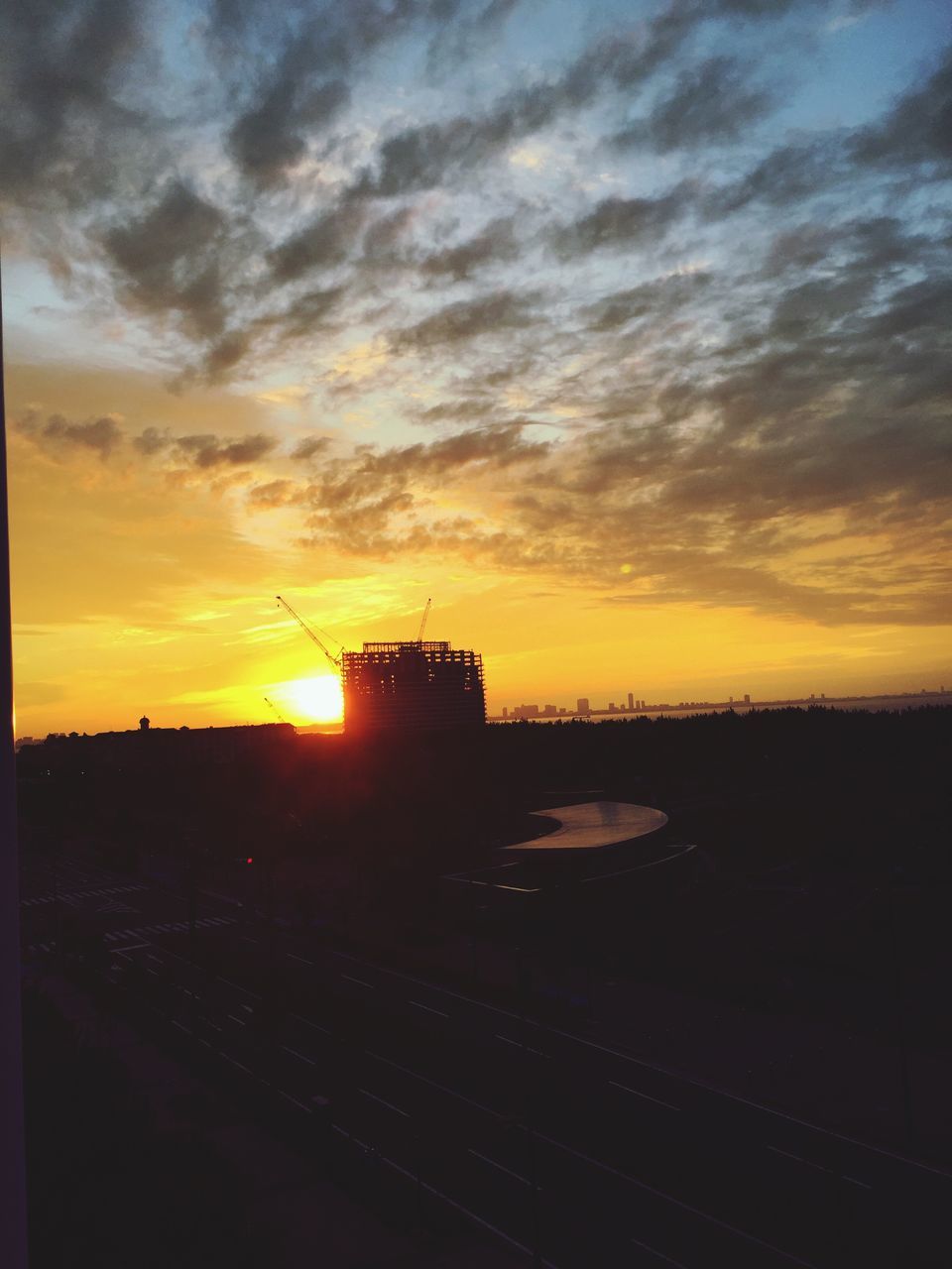 sunset, orange color, sun, no people, sky, silhouette, built structure, cloud - sky, architecture, sunlight, scenics, beauty in nature, outdoors, nature, building exterior, city, day