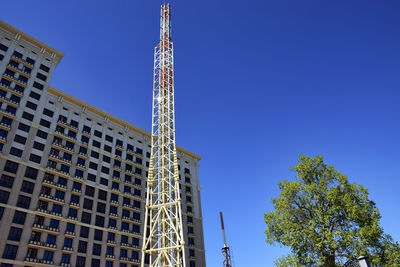 Low angle view of tower against clear blue sky