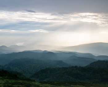 Scenic view of mountains against sky during sunset