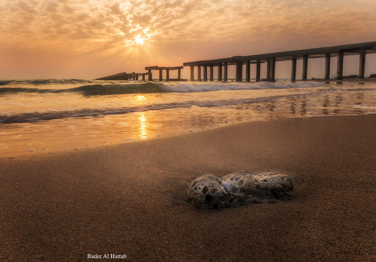 sunset, sea, water, beach, sun, shore, sky, scenics, beauty in nature, wave, tranquil scene, horizon over water, tranquility, orange color, nature, sunlight, sand, pier, idyllic, surf