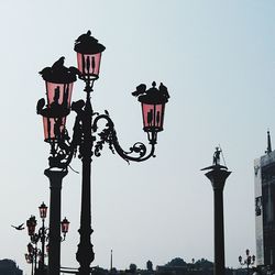 Low angle view of street light against clear sky