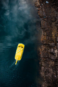 Aerial view of yellow boat in river