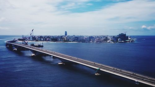 Scenic view of sea against sky in city