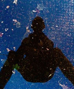 Reflection of trees in puddle