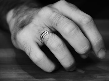 Close-up of human hand on table