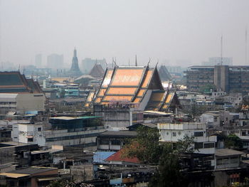 High angle view of buildings in city against sky