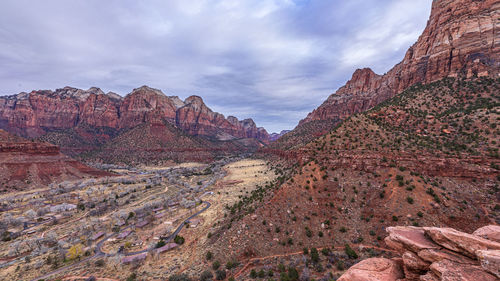 Rock formations on landscape against sky