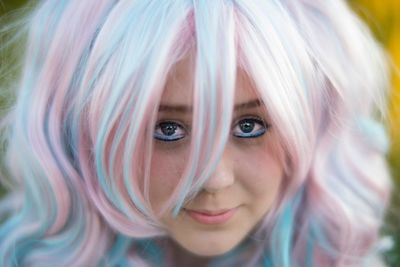 Close-up portrait of beautiful woman with dyed hair