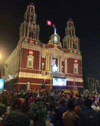 Low angle view of illuminated building at night