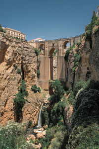 Bridge with archways uniting both sides of the town over a chasm in ronda, spain