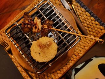 High angle view of meat on barbecue grill