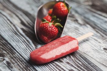 Close-up of strawberry ice-cream on table