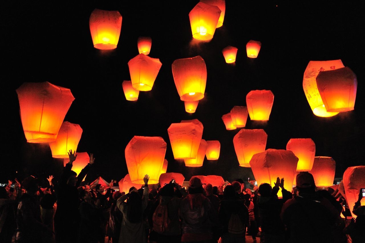 GROUP OF PEOPLE AT NIGHT