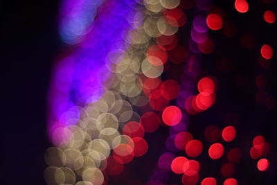 Defocused image of illuminated lights at night