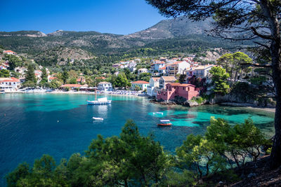 Scenic view of sea and buildings against sky