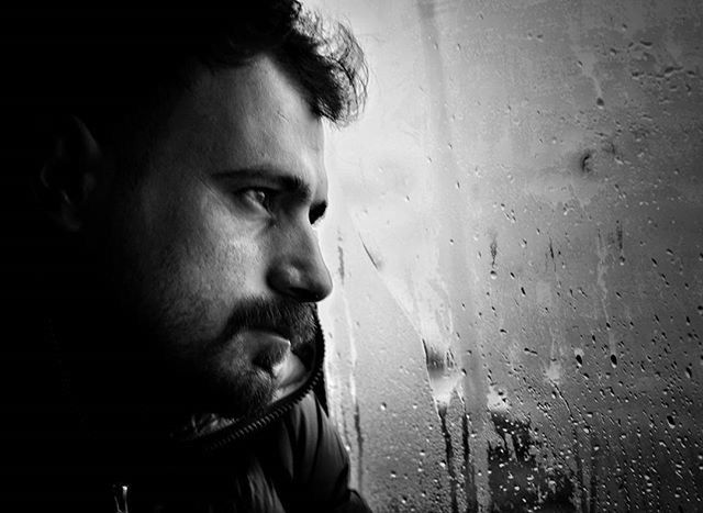 lifestyles, headshot, indoors, person, wet, close-up, leisure activity, front view, looking at camera, portrait, window, young adult, water, focus on foreground, contemplation, drop, rain