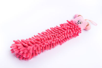 High angle view of pink toy against white background