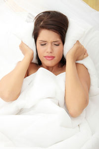 Young woman sleeping on bed