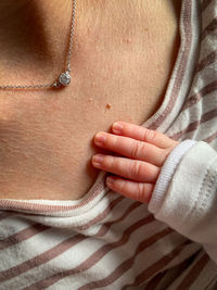 Midsection of woman with henna tattoo