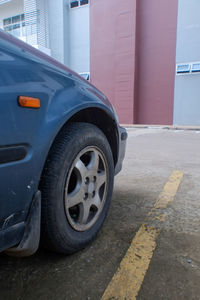 Close-up of car on road