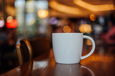 Close-up of coffee cup on table in restaurant