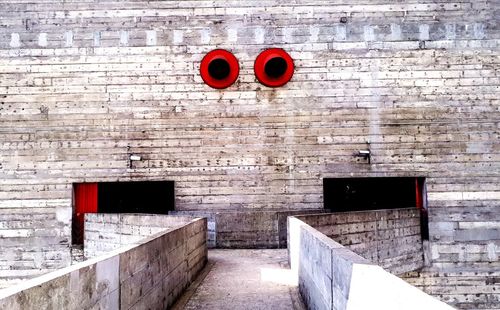 Red door on brick wall of building