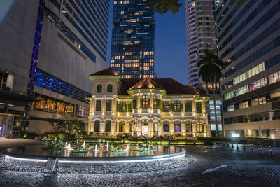 Illuminated buildings in city at night