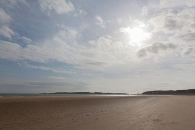 Scenic view of sea against cloudy sky