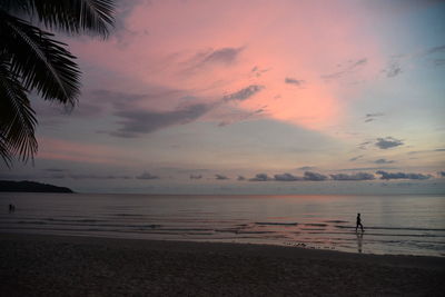 Scenic view of sea against sky at sunset