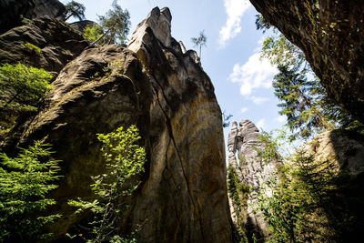 Low angle view of rock formation on mountain against sky