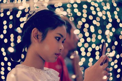 Close-up of teenage girl using smart phone