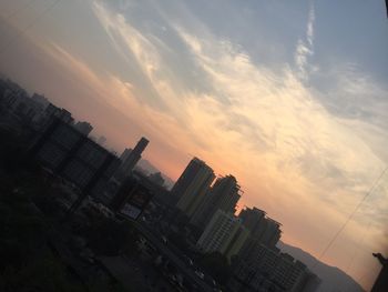 High angle view of buildings against sky during sunset