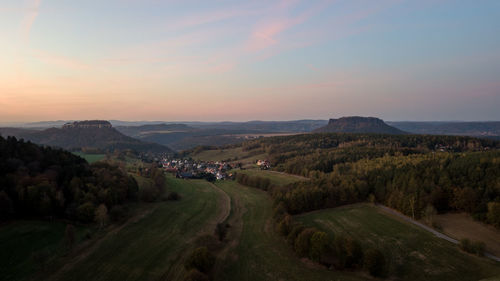 Scenic view of landscape against sky during sunset