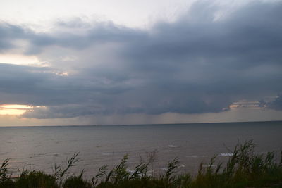 Scenic view of sea against sky at night