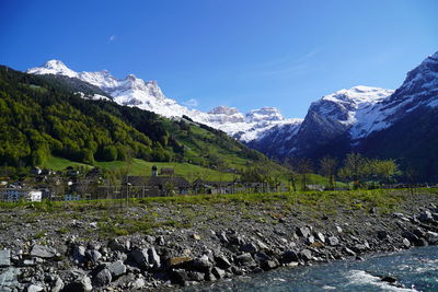 Scenic view of snowcapped mountains against sky