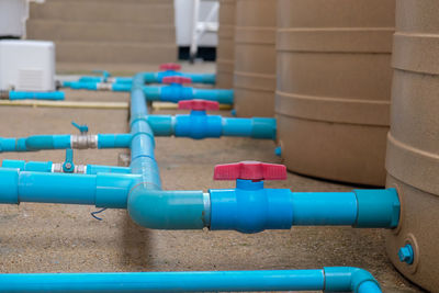 Close-up of blue pipes on table