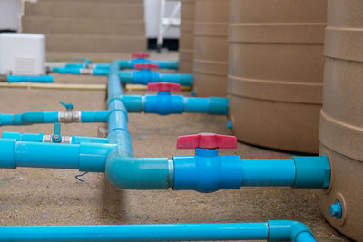 Close-up of blue pipes on table