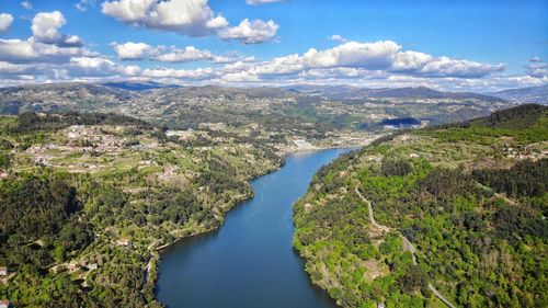 High angle view of river amidst landscape against sky